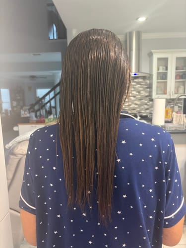 Long, smooth hair photographed from behind after the LushRoot ritual